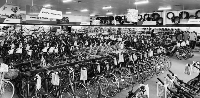 The shop floor in black and white, rows of comfort and cross bikes